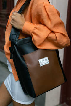 Black eco leather bag with brown details