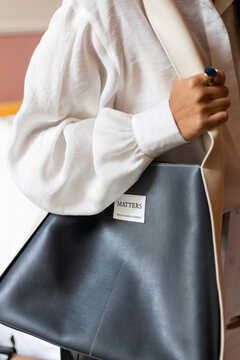 Blue eco leather bag with a white handle
